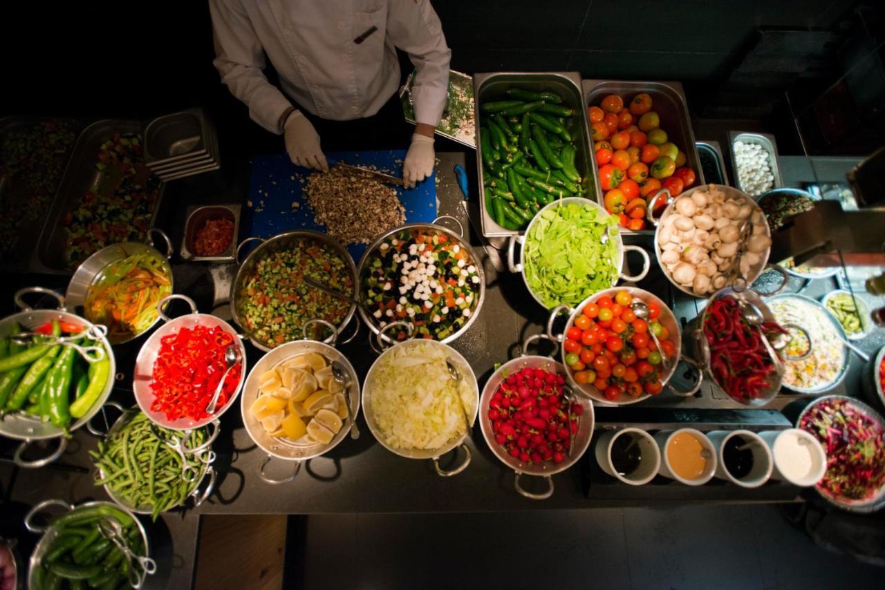 Cramim By Isrotel Exclusive Kiryat Anavim Eksteriør bilde A chef preparing ingredients for a meal